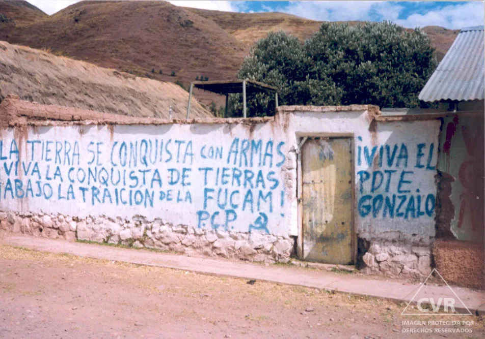 Grafitti on a building, 1990, 'THE LAND IS CONQUERED WITH WEAPONS, LONG LIVE THE CONQUEST OF LAND, DOWN WITH THE TREACHERY OF FUCAM! P.C.P. LONG LIVE CHAIRMAN GONZALO!'